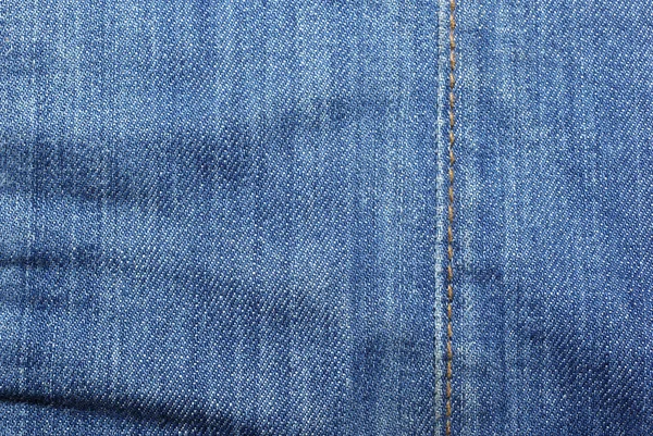 Niebieskie dżinsy z pionowym żółte szwy streszczenie teksturowanej backg — Zdjęcie stockowe