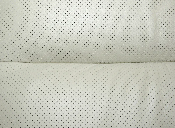 Beige perforated leather - part of modern japanese car interior. — Stock Photo, Image