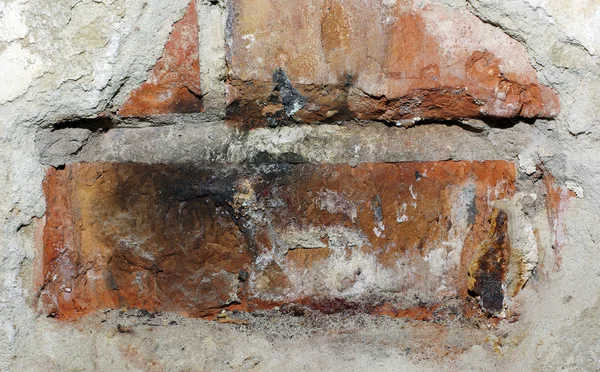 Parede de tijolo de concreto com gesso betão danificado. Textura abstracta — Fotografia de Stock