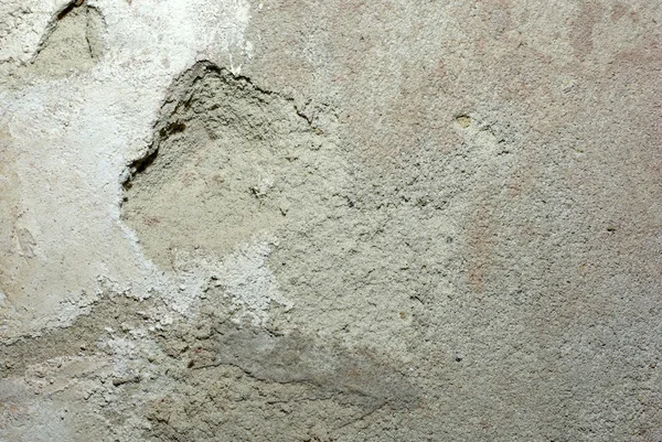Oude betonnen wand met beschadigde gips en albast daarop. ABst — Stockfoto