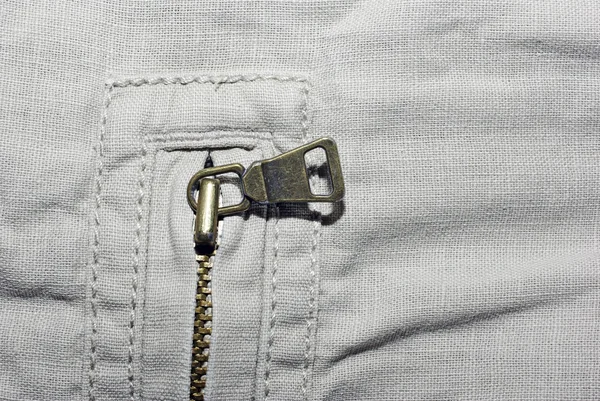 Абстрактний бежевий джинсовий текстиль з фоном блискавки . — стокове фото