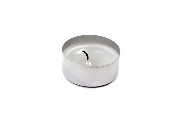 Used tea light candle close up isolated on white background. — Stock Photo, Image