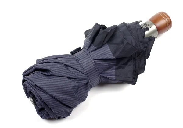Escuro azul fechado guarda-chuva fechar isolado no fundo branco — Fotografia de Stock