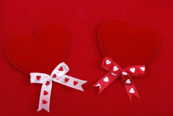 Two handmade hearts isolated on red background. Abstract love ba — Stock Photo, Image
