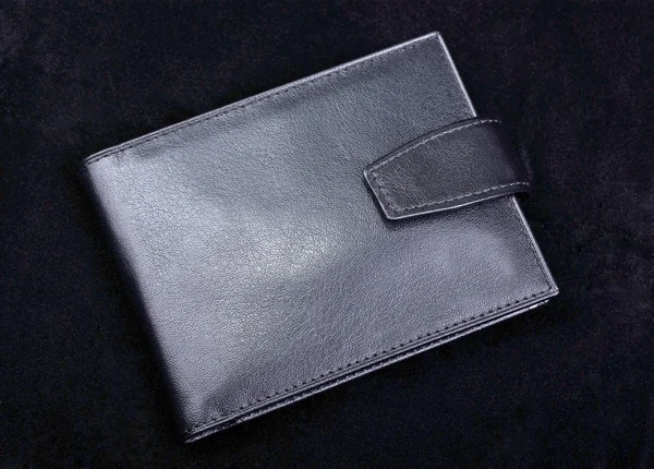 High quality leather wallet isolated on black velvet background. — Stock Photo, Image