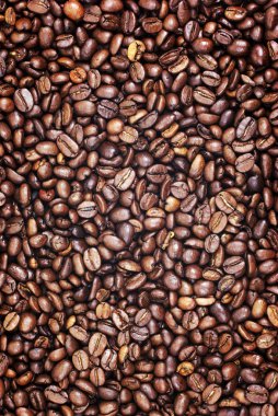 Vertical brown roasted coffee beans as background or backdrop. clipart