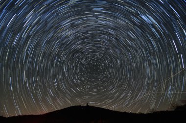 Star Trails above a Mountain clipart