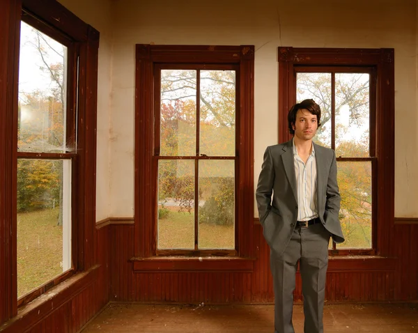 Suited man in Abandoned Home — Stock Photo, Image
