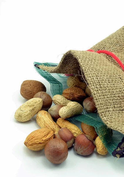 Mixed nuts in an open hessian bag — Stock Photo, Image