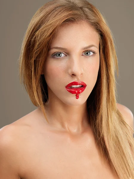 Portrait young woman red lipstick running