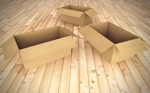 Empty cardboard boxes on floor — Stock Photo, Image