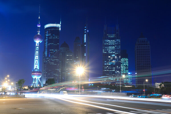 Night Light trace modern architecture background in Shanghai, China
