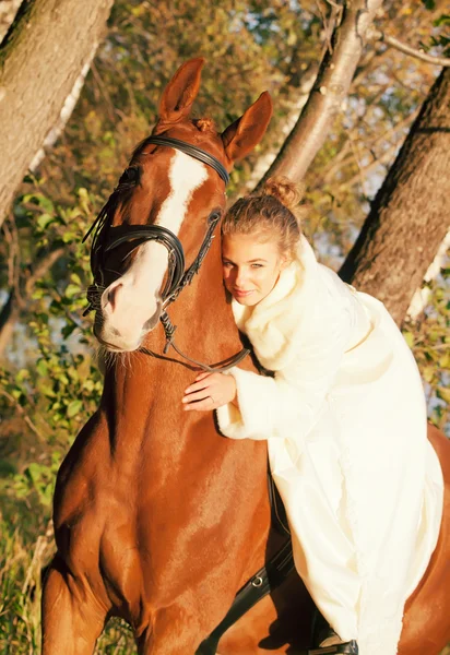 Portrait of nice young bride with horse — Stock Photo, Image