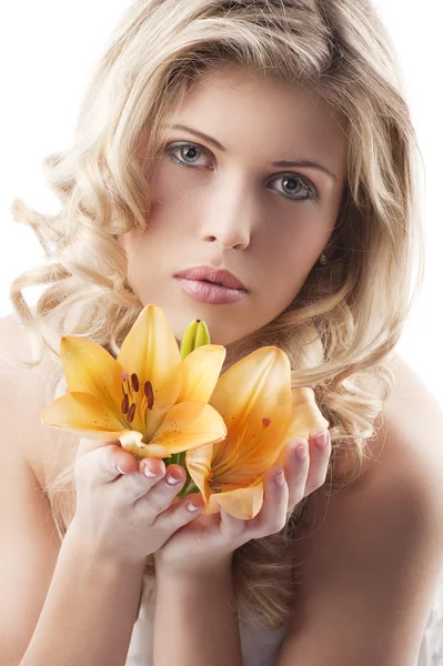 Blond curly woman holding lily — Stock Photo, Image
