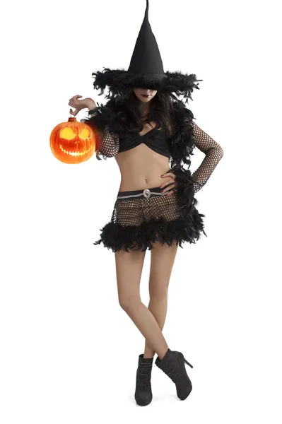 Menina em vestido de Halloween de pé com bola de festa — Fotografia de Stock