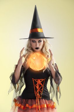 Orange witch with orange crystal ball clipart