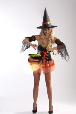 Orange witch making soup clipart