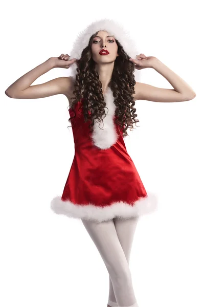 Bruneta kudrnaté mladá dívka v červených šatech vánoční s kožešinou — Stock fotografie