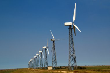 The wind generators against the blue sky clipart