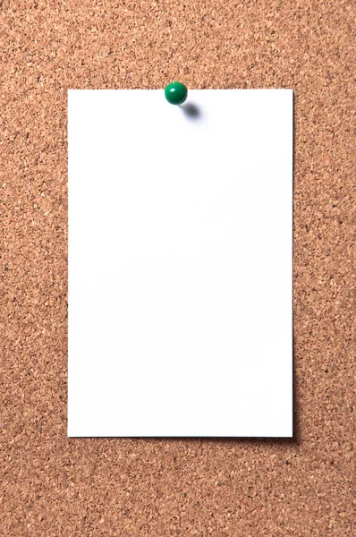 White paper on corkboard with pin — Stock Photo, Image