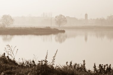 Misty morning on lake clipart