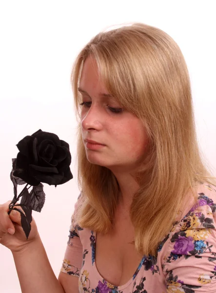 Young female and a rose — Stock Photo, Image
