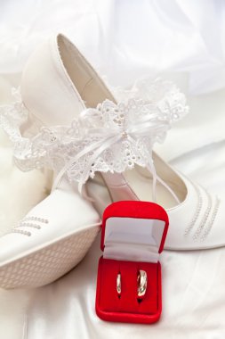 White shoes, garter and wedding rings clipart