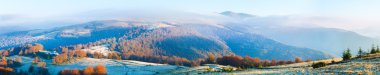 Autumn misty morning mountain panorama clipart