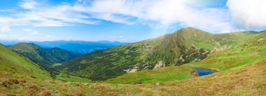 Alpine lake Brebeneckul on summer mountains (panorama) clipart