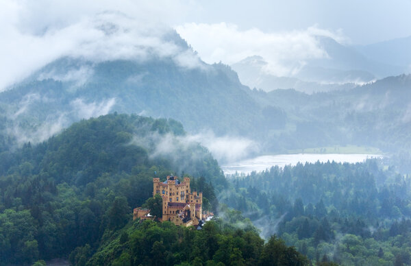 Historic medieval Neuschwanstein Castle in Bavaria (Germany). View from Neuschwanstein Palace, rain weather