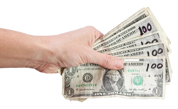 Изолированная рука с фальшивыми долларами — стоковое фото