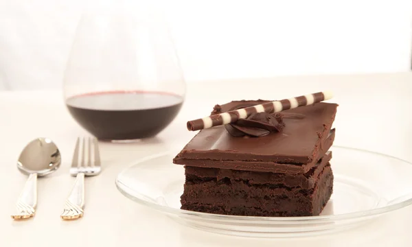 Chocolate brownie and wine background — Stock Photo, Image