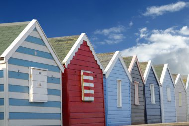 Beach huts and blue sky clipart