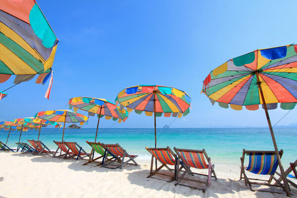 Beach chair and colorful umbrella on the beach, Phuket Thailand
