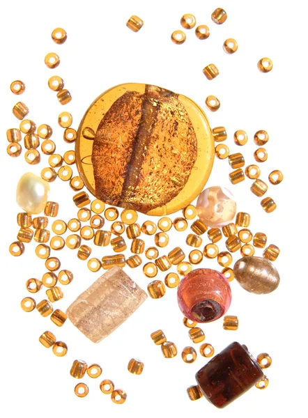 Selection of beads in amber color scheme, isolated — Stock Photo, Image