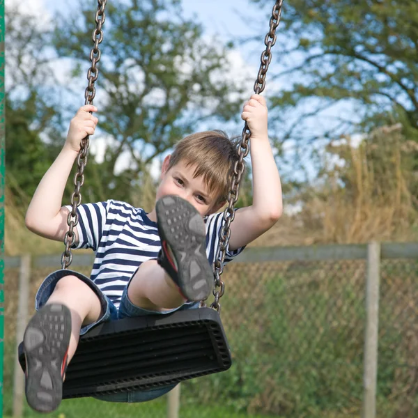 Little boy on a swing — Stock Photo, Image