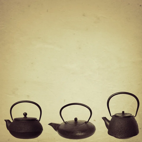 Old paper background with japanese cast-iron teapots border — Stock Photo, Image