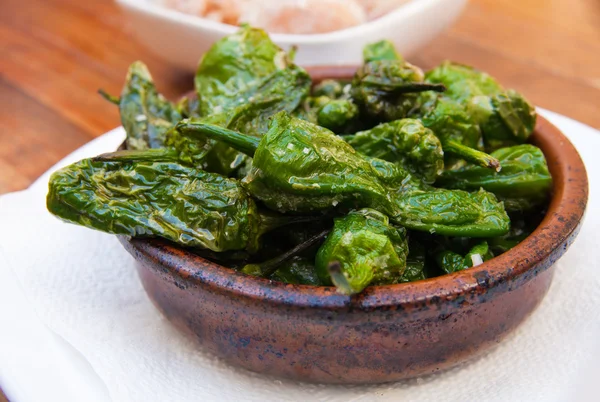 stock image Pimientos de padron - portion of shallow fried chilli peppers, w