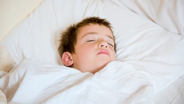 stock image Little cute boy asleep in his bed