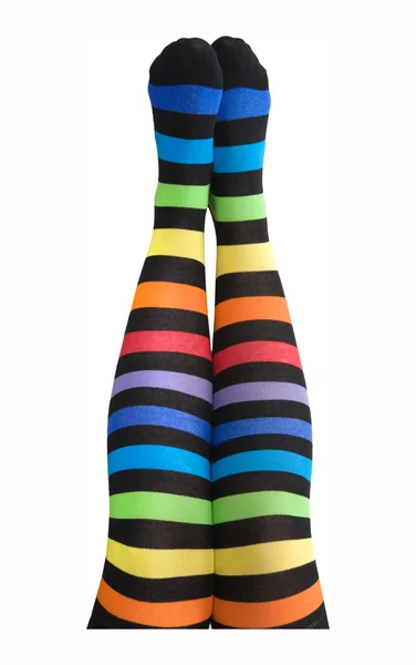 Female legs in stripy stockings — Stock Photo, Image