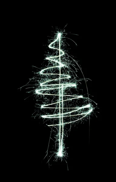 Noel ağacı ile siyah bir maytap iz hava çizilmiş — Stok fotoğraf