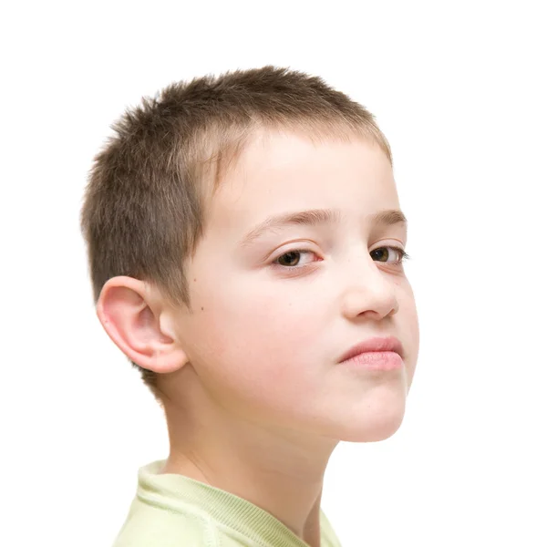Haughty face, little boy poses against white background — Stock Photo, Image