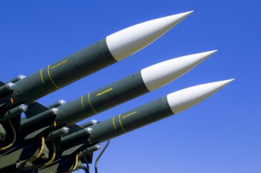 Several combat missiles aimed at the sky clipart