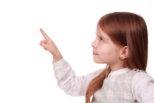 A young girl pointing at your text — Stock Photo, Image