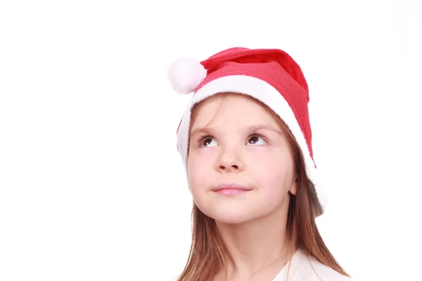 小女孩在圣诞老人的帽子 免版税图库照片
