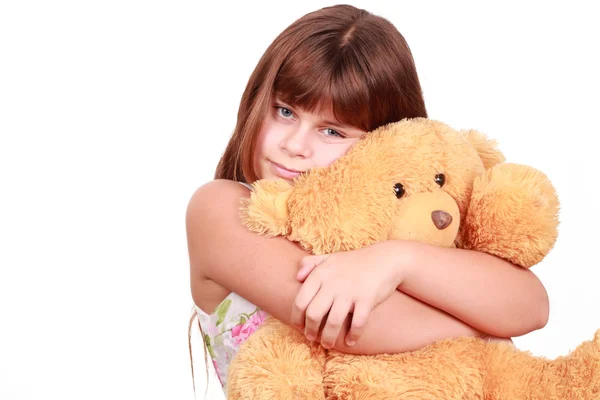 Cute little girl with toy bear — Stock Photo, Image