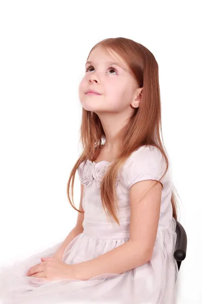Pretty little girl looks up — Stock Photo, Image