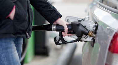 Car fueling at the gas station clipart