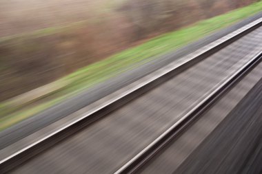 Railroad seen from a fast moving train. clipart