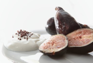 Luscious ripe figs with a little bit of white yogurt clipart